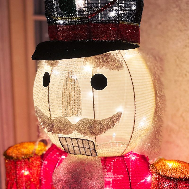 Fraser Hill Farm 6-Ft. Prelit Tinsel Nutcracker Indoor or Outdoor Decoration