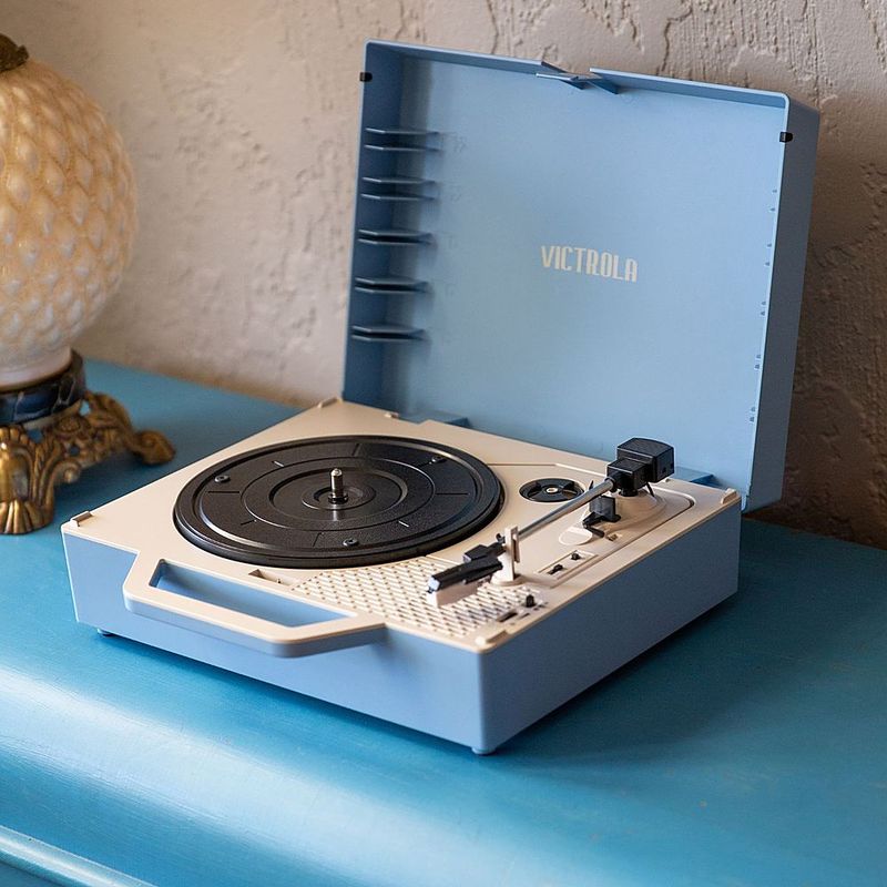 Alt View Zoom 21. Victrola - Re-Spin Sustainable Bluetooth Suitcase Record Player - Light Blue
