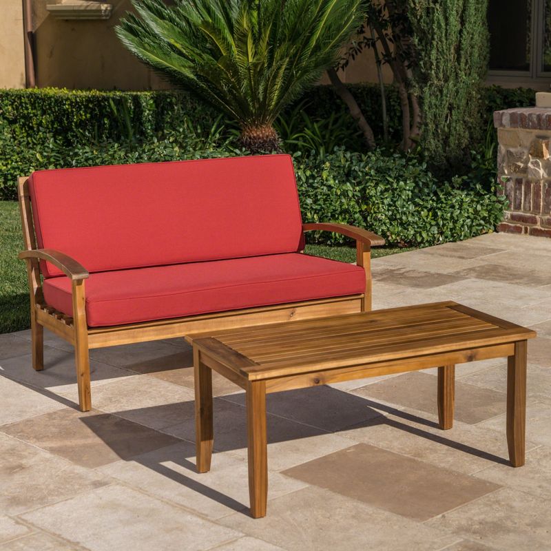 Peyton Outdoor 2-piece Acacia Wood Loveseat and Coffee Table Set with Cushions by Christopher Knight Home - Teak Finish + Red
